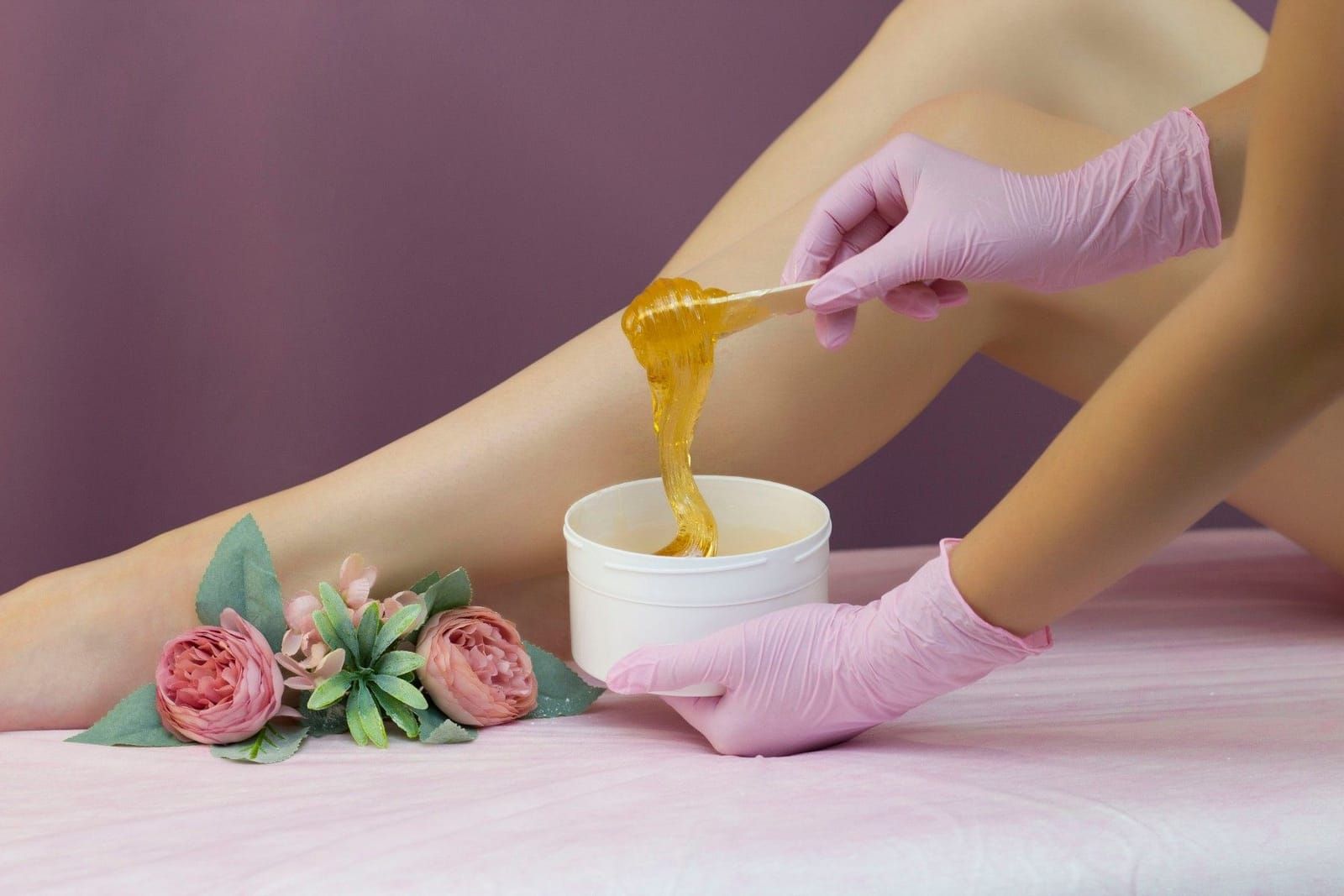 Hard wax being prepared for a waxing service at Rozy's Threading & Waxing Studio